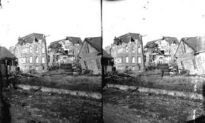SC#194-43 Looking from across street at wrecked Galveston Orphans Home and houses.